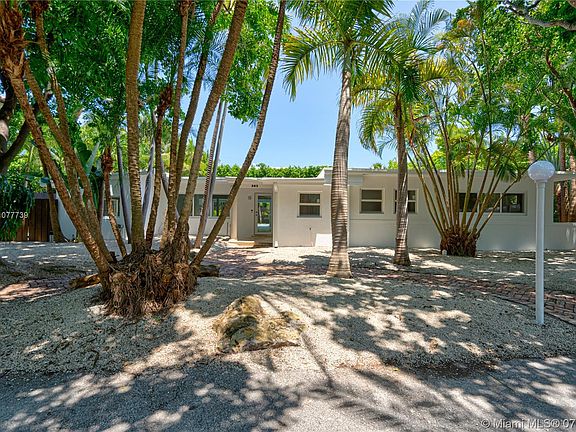 Exterior Front view. Note see thru view with pool visible from front door