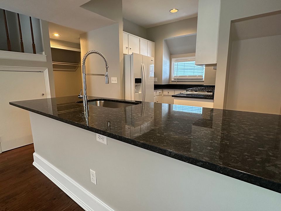Granite countertops in kitchen with large single bin sink