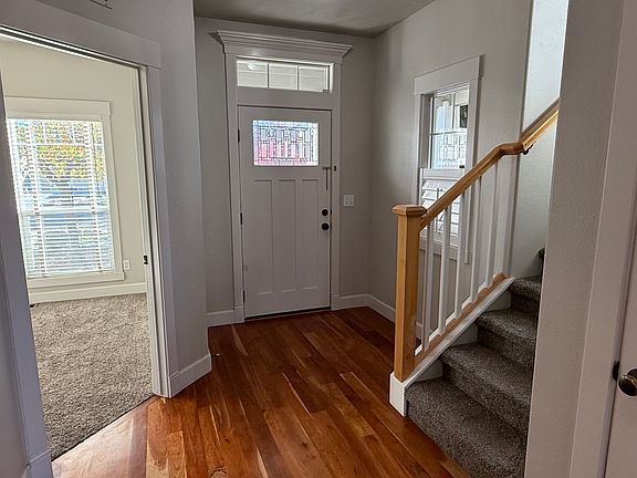 Front entrance. Stairs to upstairs bonus room, 4 bedrooms, and two bathrooms. Entrance to 6th bedroom or office on the left.