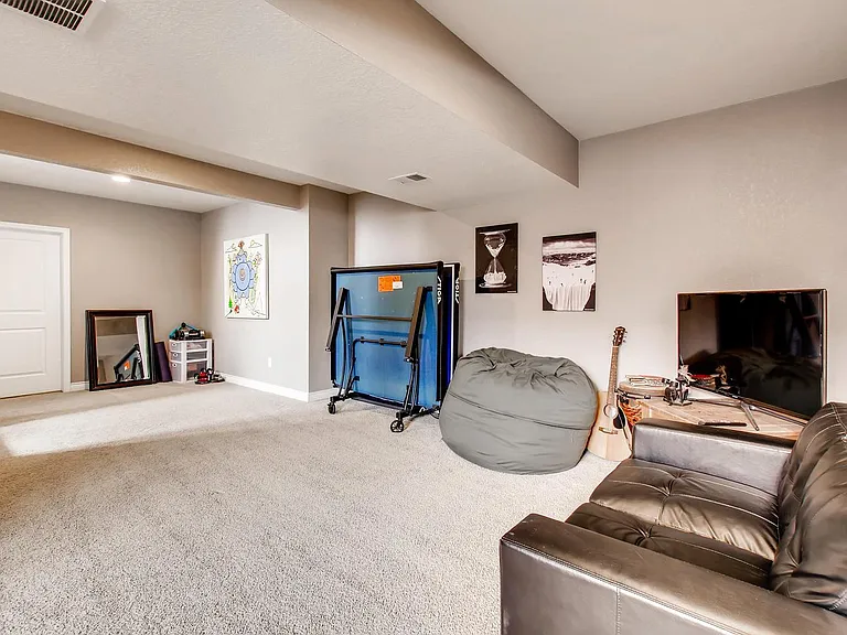 Massive Basement living area with unfinished room for storage