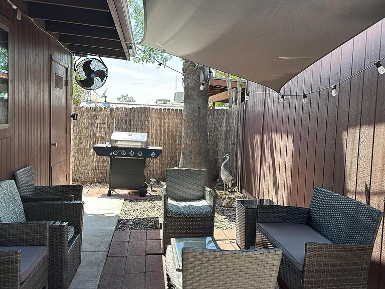 Beautiful outdoor area with lights and fan