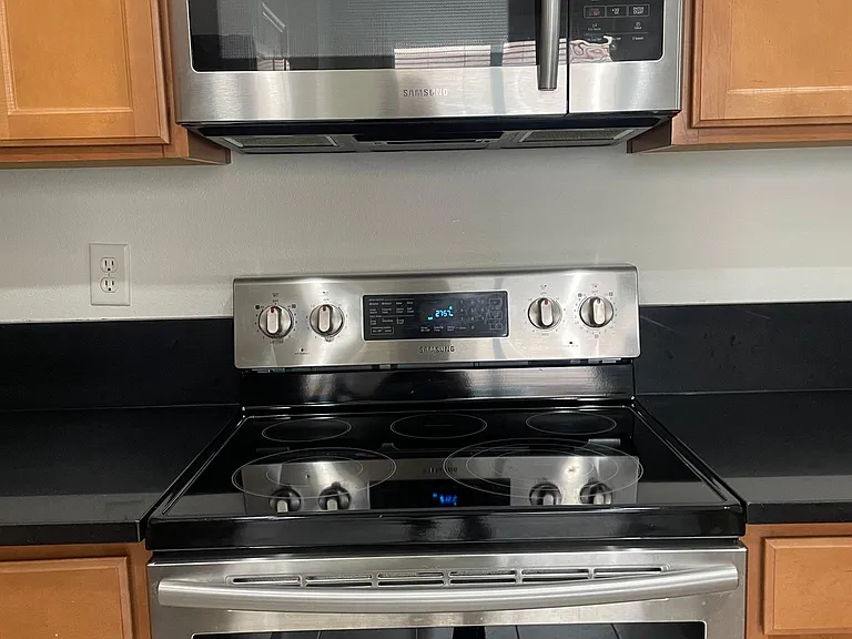 Glass top stainless steel oven with matching microwave