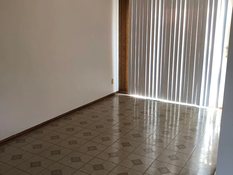 Kitchen entrance that leads to rest of kitchen and the patio door