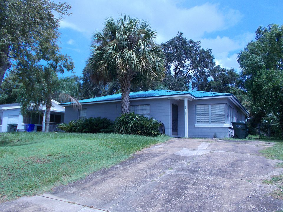 Front yard and rising driveway to home