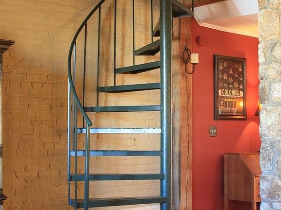 circular stairs to upper level three rooms