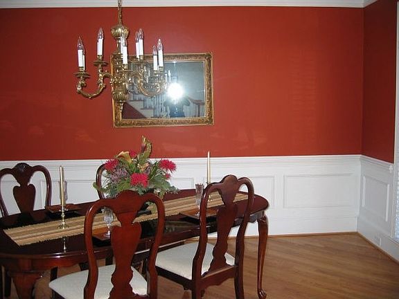 Dining room with hardwood floors and trey ceilings