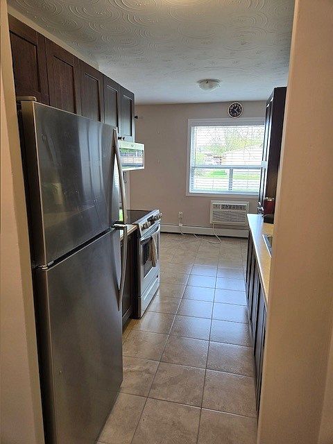 Kitchen, entering from foyer (with main closet)