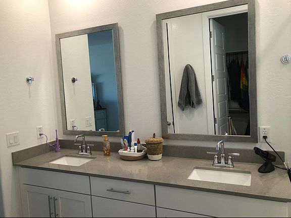 double sinks, separate toilet room, and large closet in the primary bath