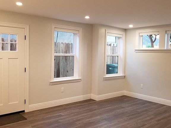 Bright living room space with lots of windows