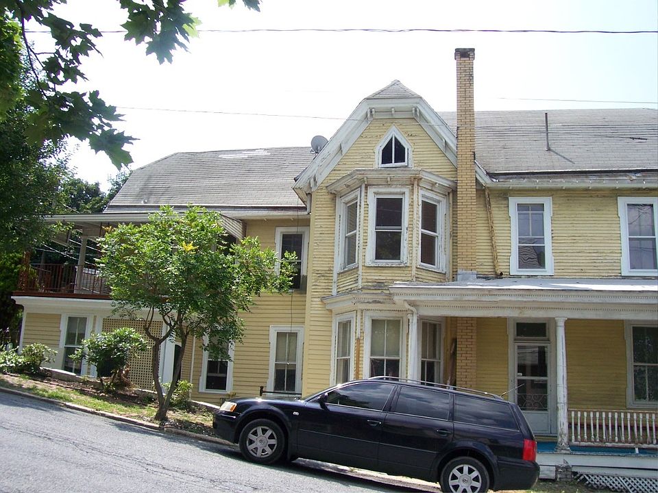 Front view, prior to paint; upper apartment, private rear ac