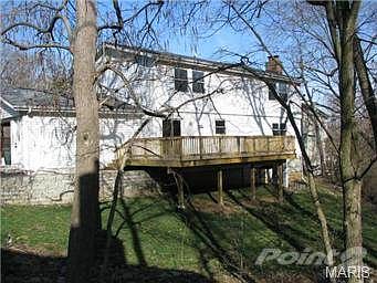 Back of house with 12' x 28' Deck off Kitchen