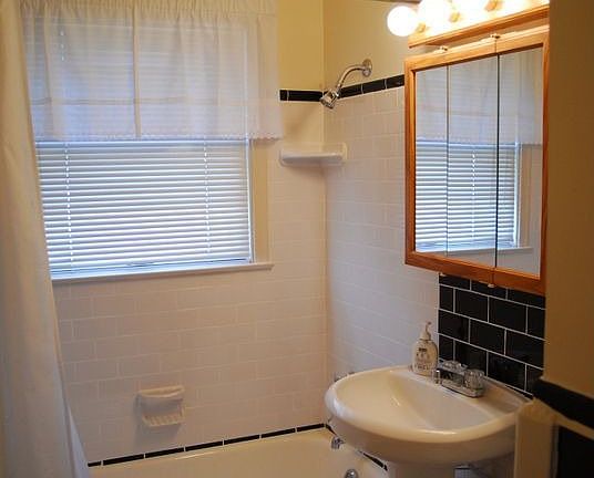 Updated bath features ceramic tile & newer fixtures.
