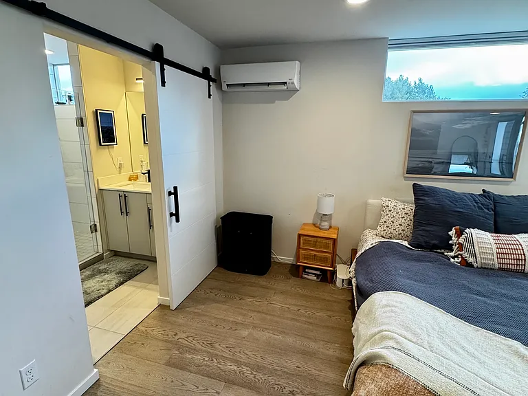 Primary bedroom and en-suite bathroom on top floor.