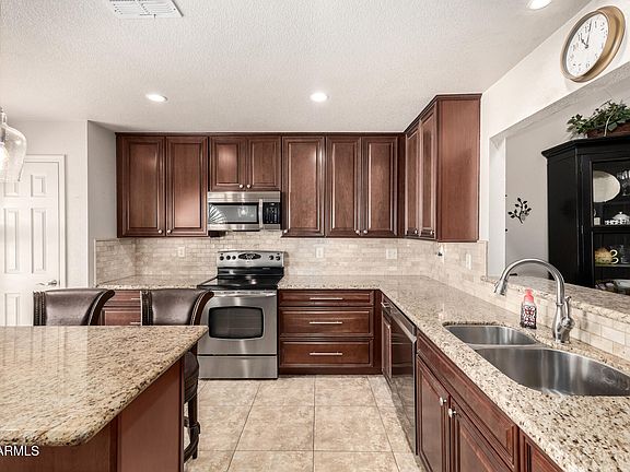 5th image of 8719 W CAROL Avenue