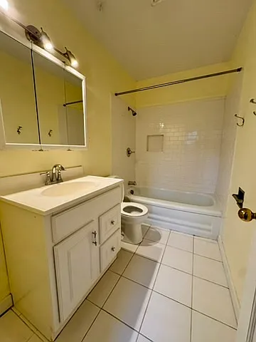tiled bathroom with bathtub