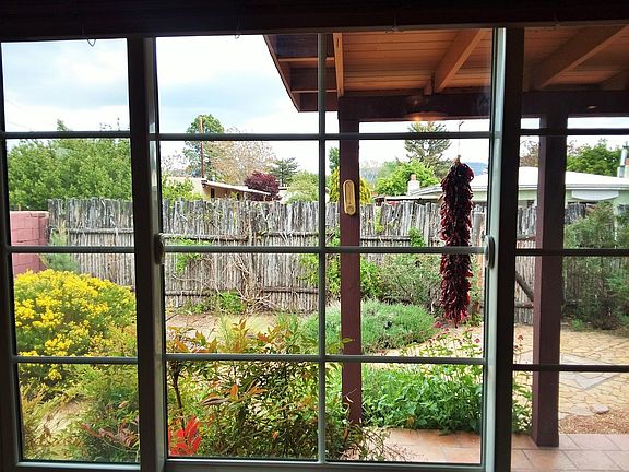 Beautiful garden and front porch view from the living room.