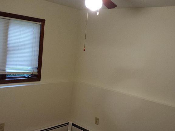 Bedroom #2: window faces west overlooking rear yard and parking pad.