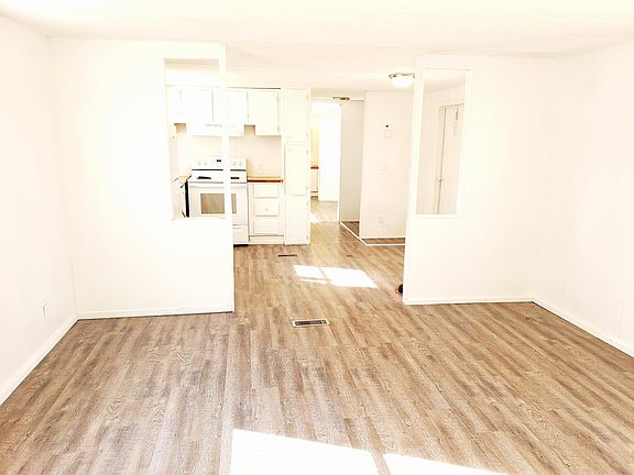 Unit 10 is naturally light inside. New floors and new white paint.