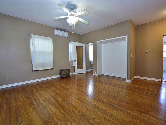 large and bright studio with charming original hardwood floor, new A/C, ceiling fans