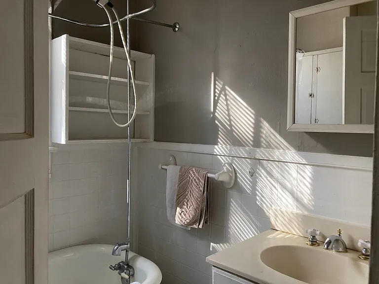 Bathroom with clawfoot tub and shower