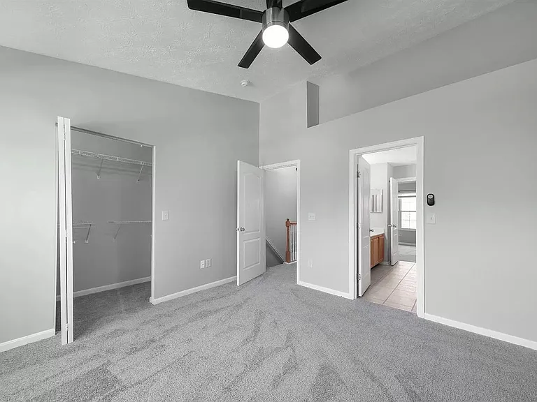Front bedroom with vaulted ceilings - hallway view