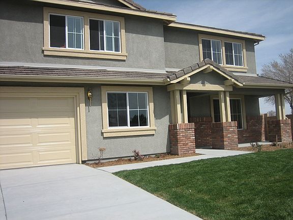 5 bedroom 3.5 ba, double car garage, porch, front yard with auto sprinkler