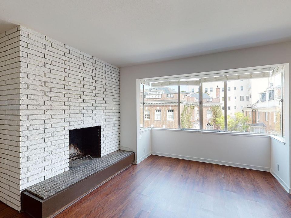 Living room with wood burning fireplace