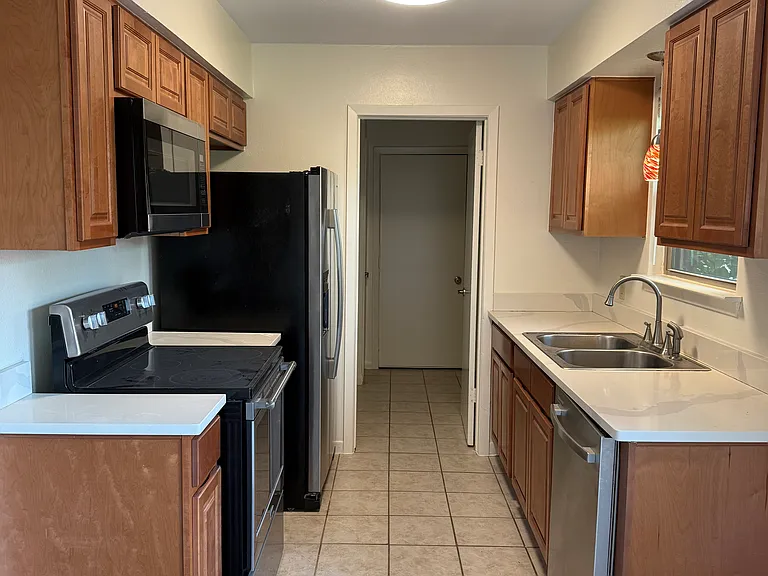 Kitchen with door to laundry room and door to garage