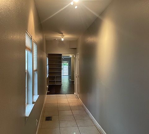 Looking into the house and along the long hallway from the front door