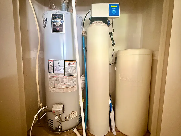 In the garage has the hot water tank and next to it is a water softener. Please remember to add salt!