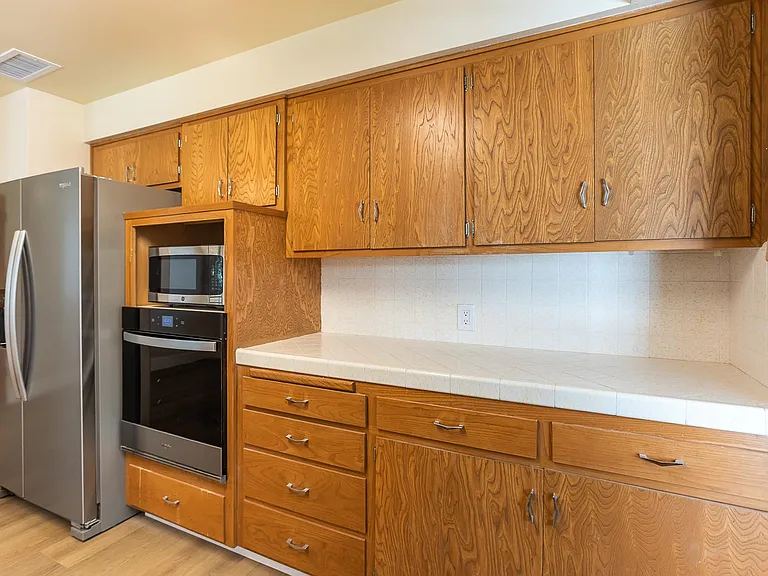 Kitchen with new fridge and oven