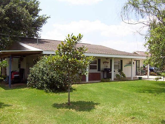  View of back of the house, covered patio - pool to the right out of view.