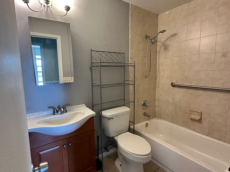 Bathroom with tub and shower combination