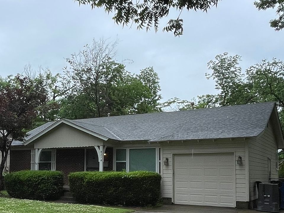 Front with large driveway