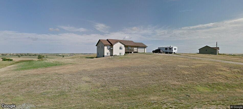 Front with travel trailer.