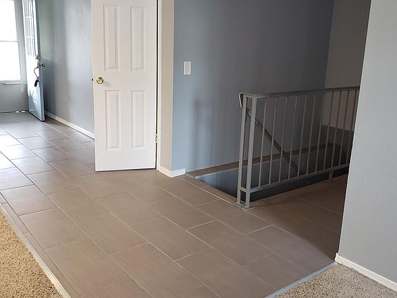 Front door entry way, closet, access to Basement, living area, hallway to main bedroom and full bathroom