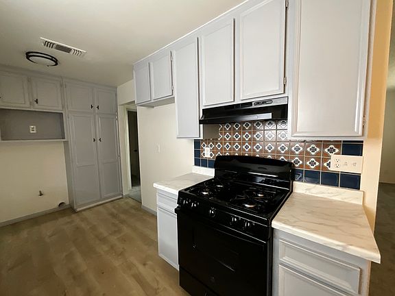 New stove and freshly painted interior of kitchen