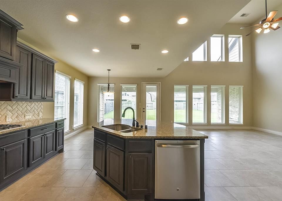 14x14 Kitchen - Breakfast area in background to the left and Family room to the right. This will be the view while preparing those amazing meals for the family. Just picture them in this photo.