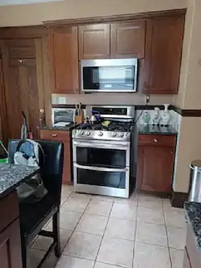 LG Double oven with 5 burner range. Smart Whirlpool Microwave.