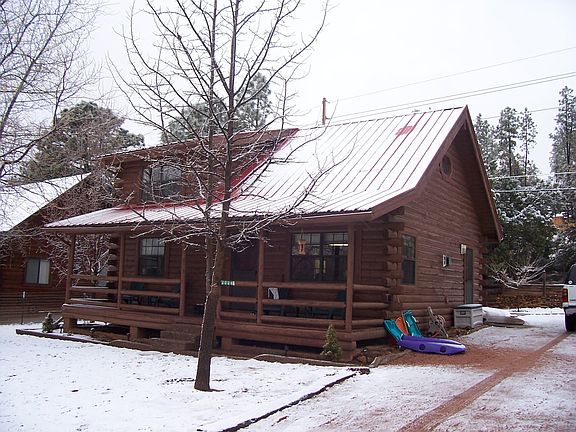 1st view from front of log cabin in winter