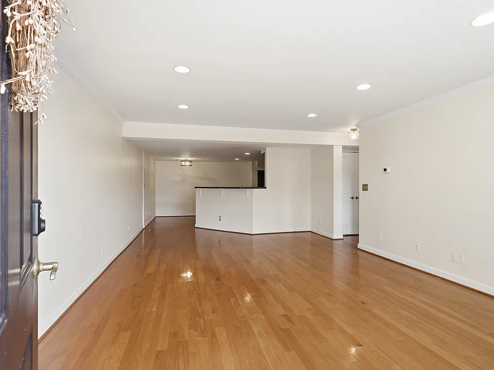 Living room with hardwood floors and recessed lighting