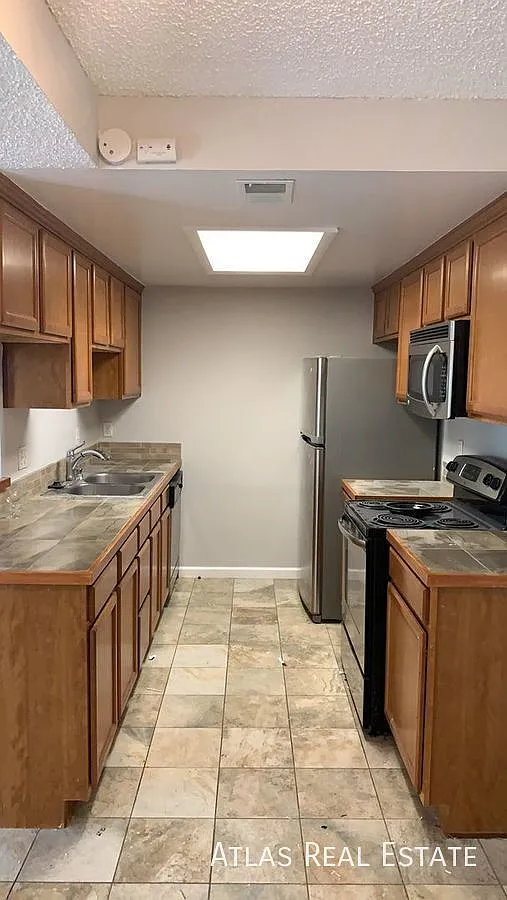 Now Available! 2 Bed, 1 Bath Condo With Attached Garage Near Buckley Air Force Base! — Photo 1