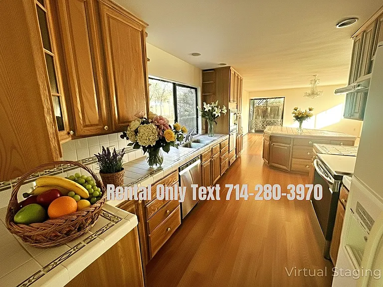 Enhanced photo of 30242 Via Borica. Kitchen with plenty of storage and an island where breakfast can be served on second floor