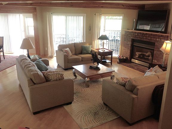Living Room w/ gas Fireplace
						:
						Living Room with Hardwood Flooring, gas fireplace and views to the 6th Fairway.