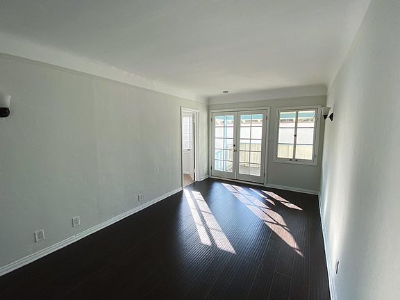 Reverse of living room with great lighting from french doors