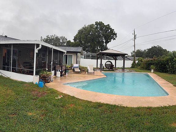 Swimming Pool with an expansive backyard