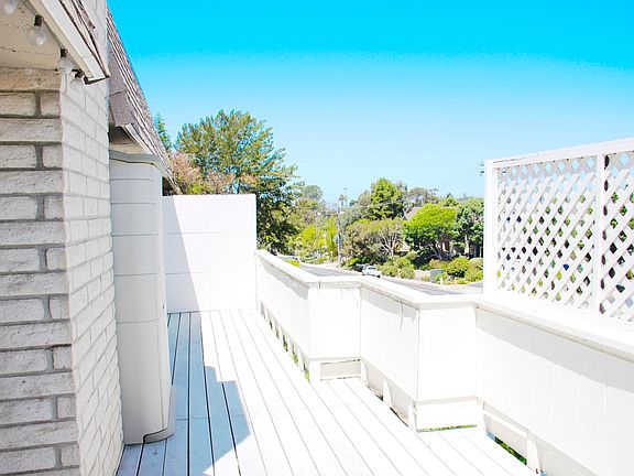 Large Deck area with small storage unit.