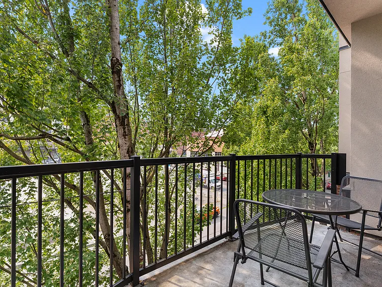 Large deck with tree view.