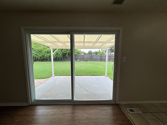 Huge sliding glass doors to beautiful backyard