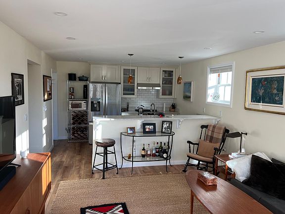 living room area with open kitchen